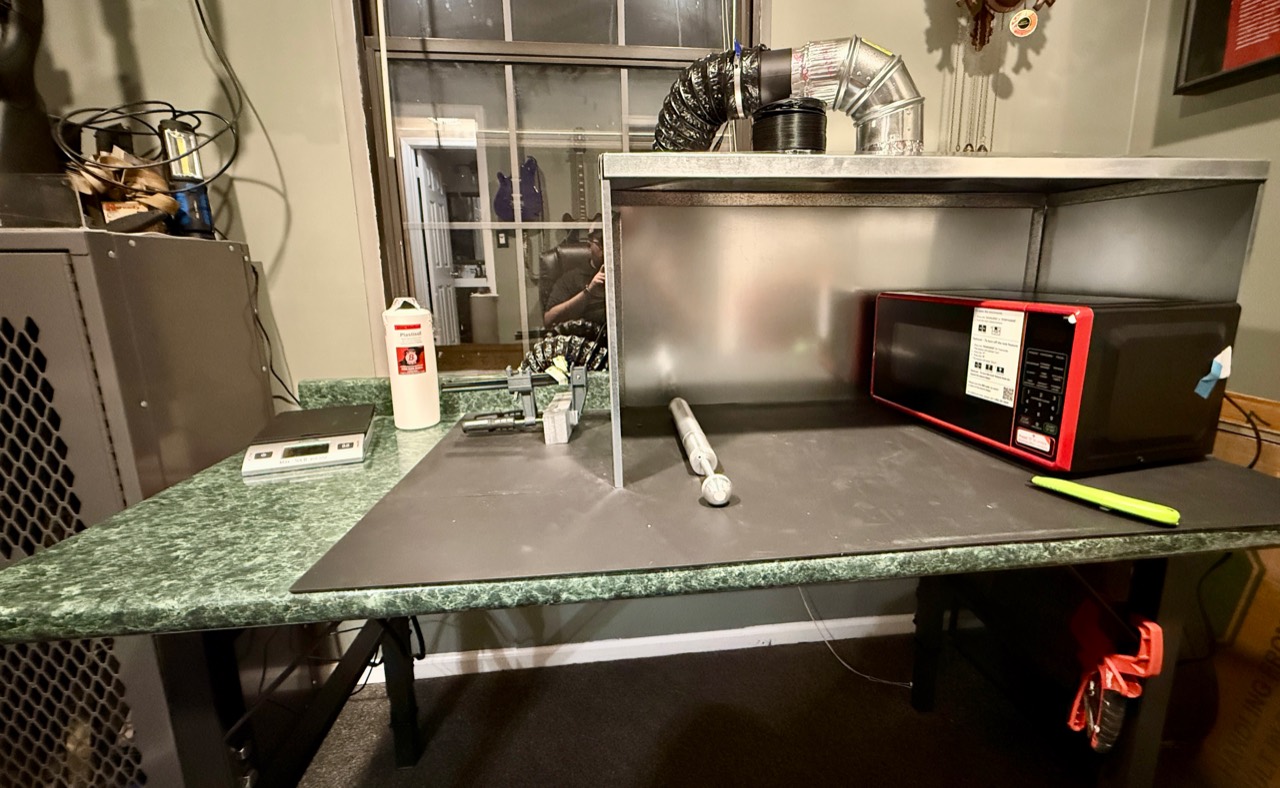 CBC workbench with injection tools, a mold, and the workshop setup